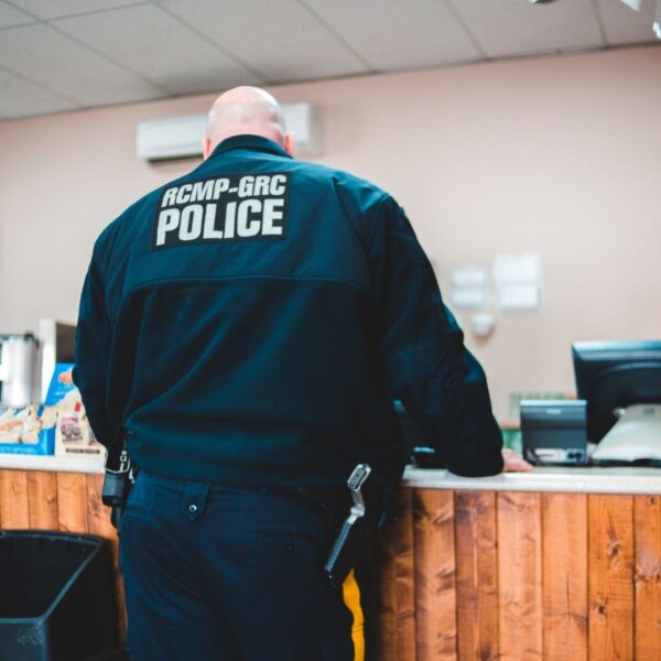 police office standing at counter